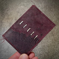 W02 horizontal card holder in burgundy reverse culatta leather with .925 silver staples