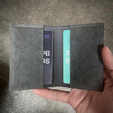 W02 horizontal card holder in grey culatta leather with .925 silver staples