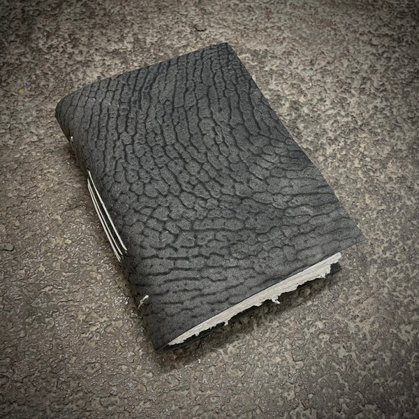 OB03 A6 notebook in grey horse culatta leather with hand cut raw paper